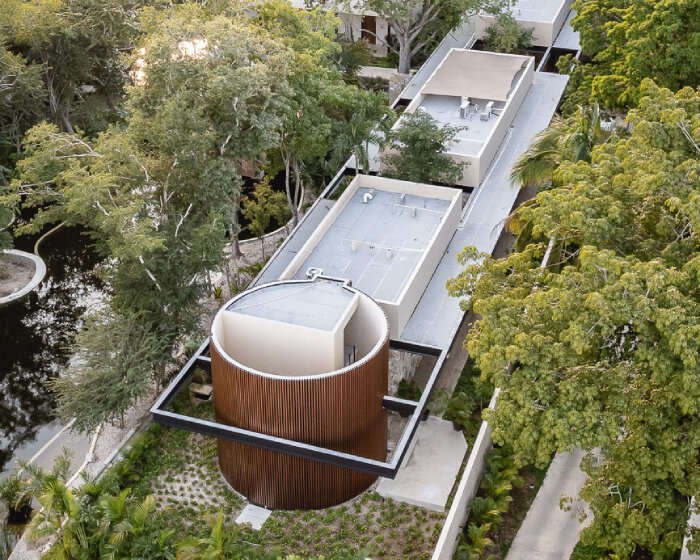 lush vegetation and stone walls enclose taller mexicano de arquitectura's hotel spa in mexico