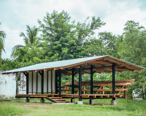 steel and rubberwood pavilion creates open-air learning space in rural thailand school