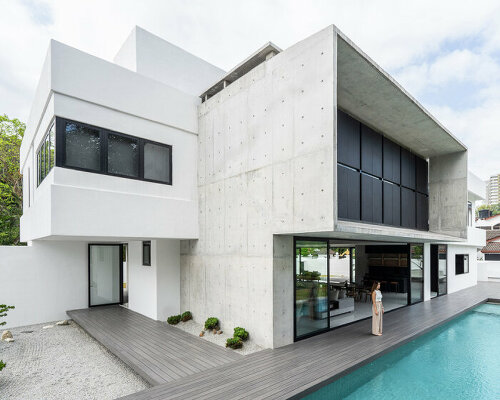 vast shuttered wall blurs thresholds at fabian tan's concrete house in kuala lumpur