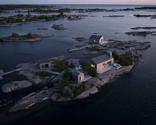 clustered 'whistling wind' cabins by akb architects perch atop tiny canadian island