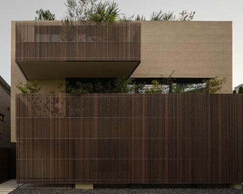 keiji ashizawa's house in aoyama is a concrete body with protruding wooden louvers