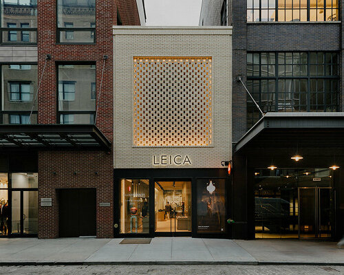 brick-screen facade highlights leica store & gallery in revitalized 1950s NYC meat market