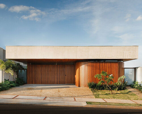 brazilian architect laercio fabiano curates warm, modern design with dali twins house