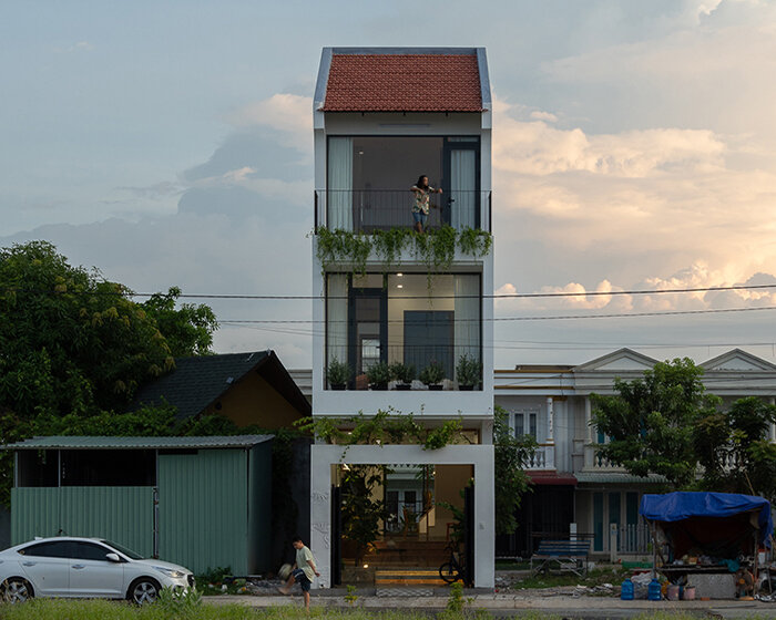 dual facades and central skylight illuminate dat tran's residence in western vietnam