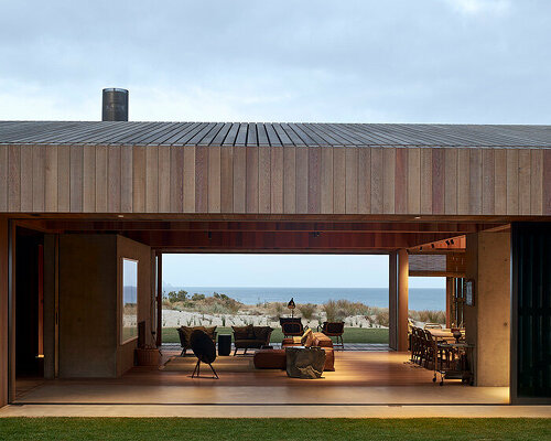 te arai beach house by fearon hay frames new zealand dunes through timber shutters