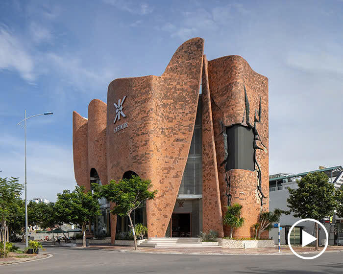 fluid brick-clad facade undulates around karinox coffee shop in vietnam