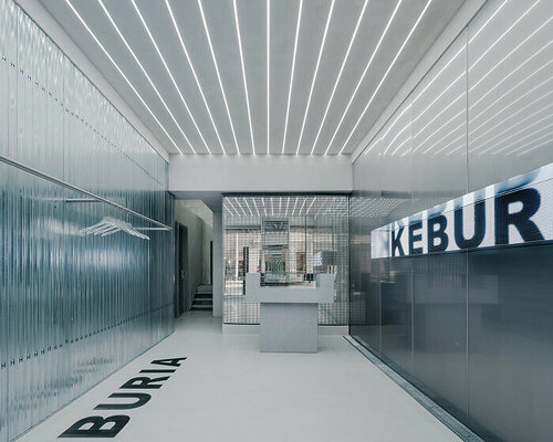 stainless steel and mirrors reflect keburia retail space's futuristic interior in georgia