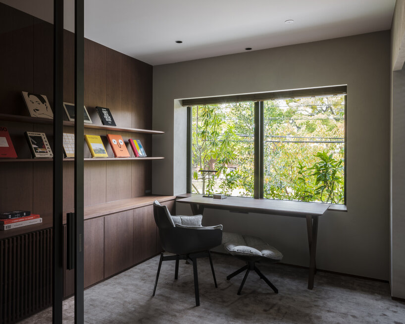 verdant tiered terraces envelop NOT A HOTEL's facade in fukuoka