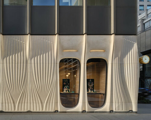 partisans sculpts parametric limestone facade with sinuous arches at toronto rolex boutique