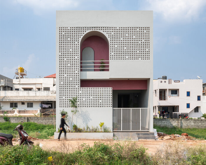 perforated terracotta facade enfolds rahul pudale's porous adobe in india