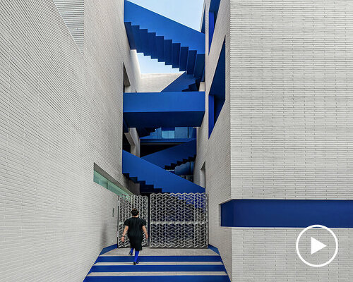 vibrant blue staircases connect courtyard-centric iranian residence by rooydaad architects