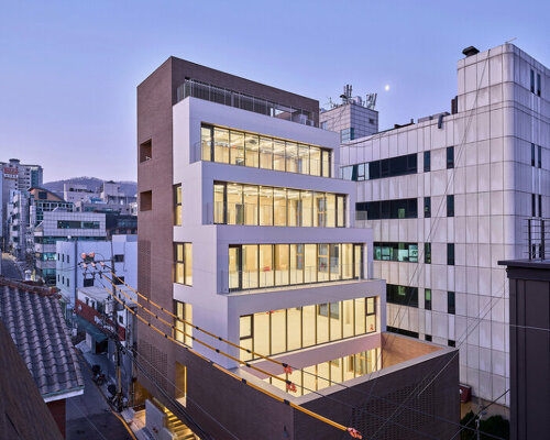 stepped facade extends from brick volume in mlnp architects' mixed-use building in seoul