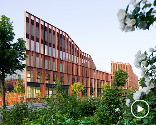 brenac & gonzalez & associés fronts wave-like building with vertical metal slats in france