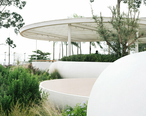 an array of white pebble-like forms shapes VMA's coastal restaurant in thailand