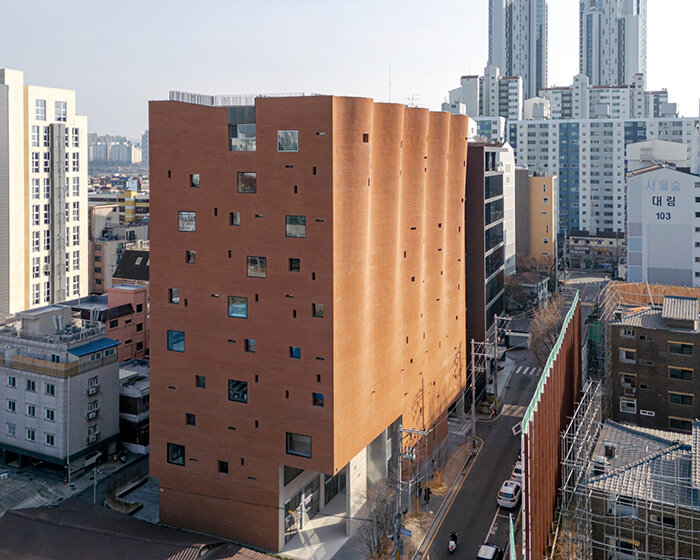 rippling brick facade by behet bondzio lin architekten envelops textile headquarters in seoul