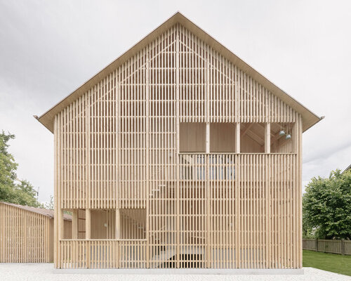 scalloped shingles and timber screens wrap modern austrian home by MWarchitekten