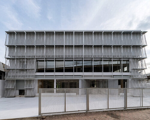 archive auto by PHTAA unfolds angled mesh panel facade in bangkok