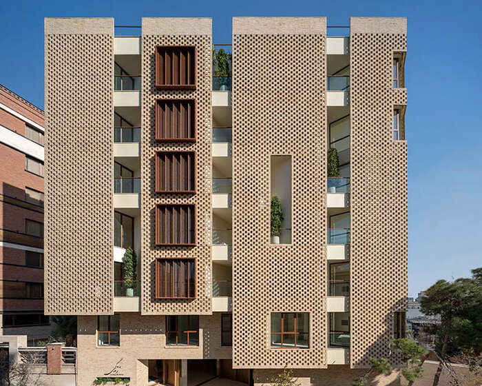 brick-layered facade shields zendegi building from harsh sunlight in tehran