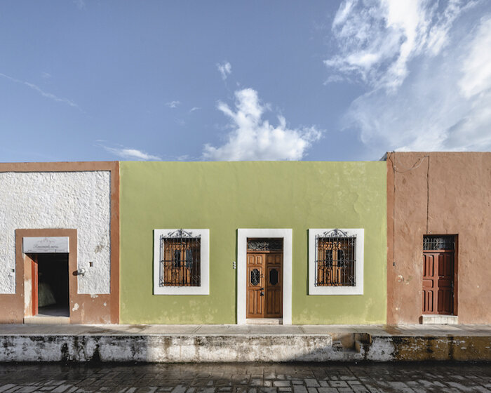 casa verde stands out in bright green facade after renovation by richaud arquitectura