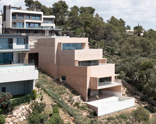 pedro cardigo captures alvaro siza's casa colien, a stepped concrete volume in hilly barcelona