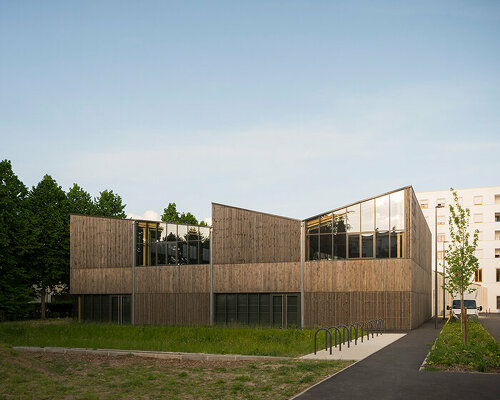 wooden facade wraps social facility by DREAM in villejuif fostering connection to nature