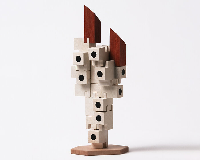 oscar diaz pays tribute to iconic nakagin capsule tower with playful wooden block set