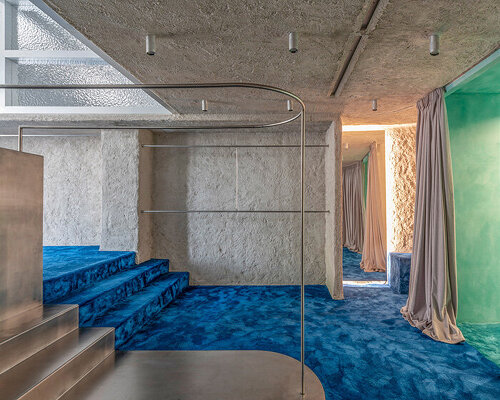 continuous blue carpet evokes coastal spain within raúl sánchez's store interior in ibiza