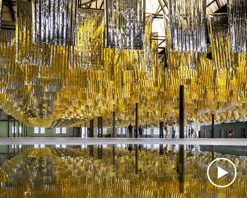 reflective sea of salvage blankets by SpY whispers inside former oviedo weapons factory