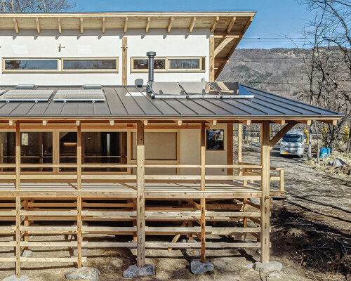 sobokuya rests wooden home on stone foundation near mount yatsugatake in japan