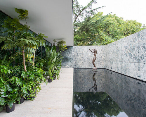 mies van der rohe's barcelona pavilion blooms with tropical intervention by caio reisewitz