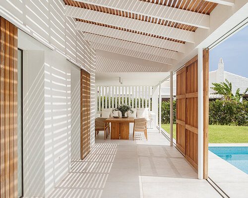 E+E house: architect gabriel montañés frames menorca coast through sliding timber shutters