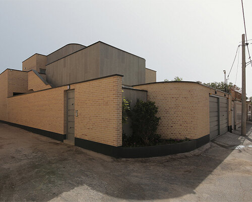 illuminating voids puncture through brick-laid annab house in iran