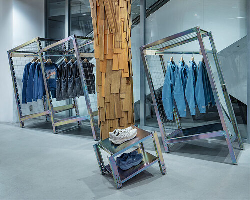 ATELIER WRITE repurposes steel racks into clothing stands for new balance's retail dispay