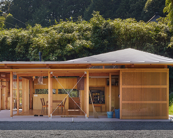 curved roof follows ridgeline of japanese mountains in weekend home by OTA archistudio