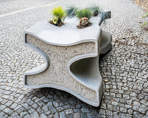 concrete bench X doubles as a planter, reflecting czech republic's gothic heritage