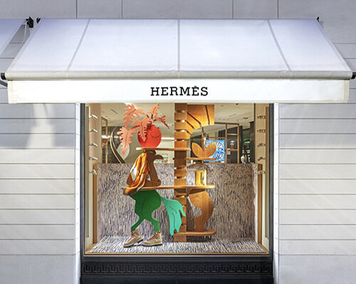 Hermès faubourg marks 100 years with surreal figures animating its windows displays