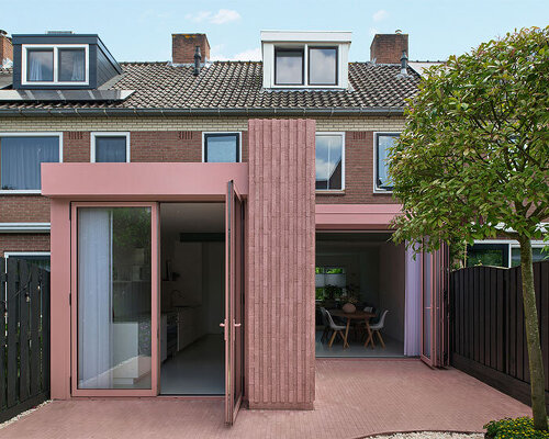 vertical pink concrete bricks wrap atlas architects' rosa home in the netherlands