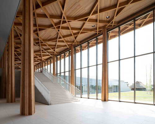 shigeru ban architects' toyota city museum illuminated with emblematic timber skylight