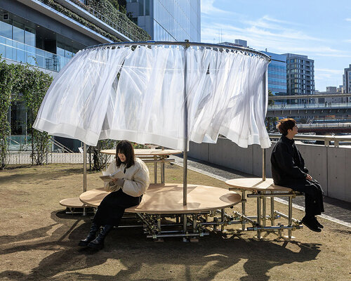 wind and light flow through organdie curtains of icai architects' street furniture in japan