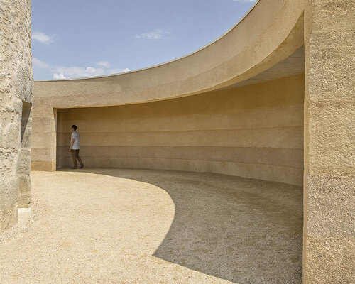 mix of local sands crafts wine storehouse's lime plaster exterior by carmen maurice in france