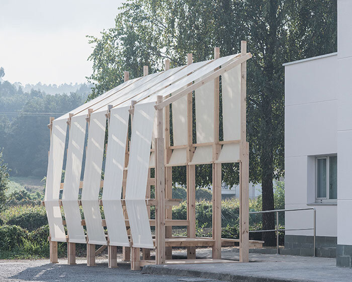 erazo pugliese and cesuga cover modular wooden installation's frame with translucent fabrics