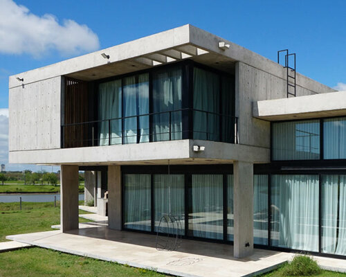 glazed openings puncture through concrete casa pevi in buenos aires