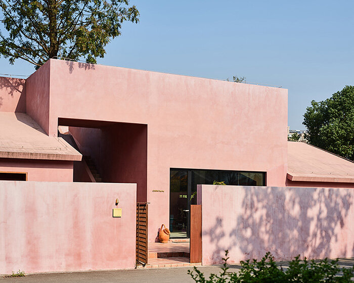 cherry blossom pink cement coats cultural space by qicang design in china