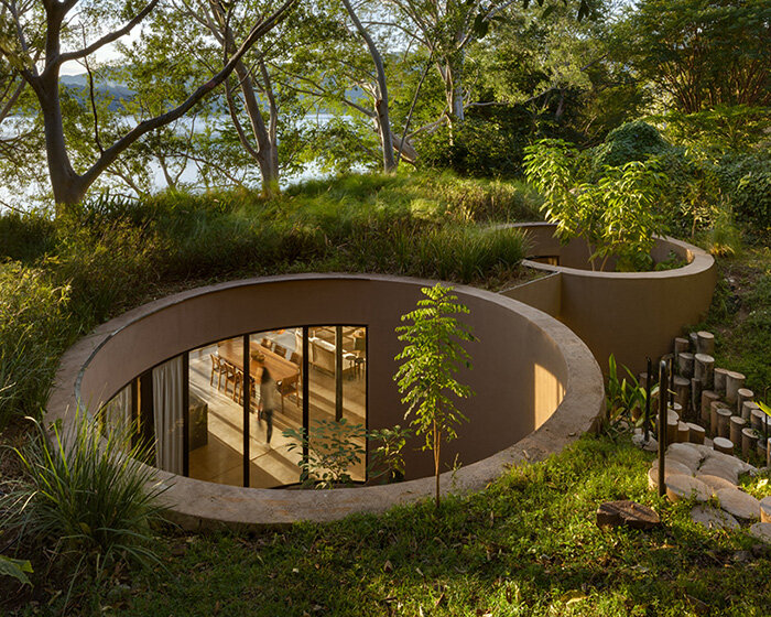 circular voids embrace mexico's ancestral trees in eco-conscious residence by MCxA group