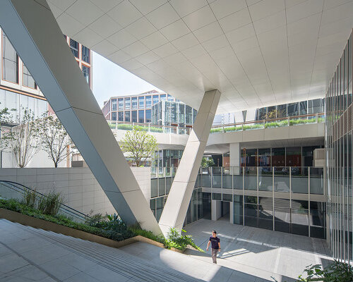 finance center's undercut building bases by AI planetworks form communal hub in shanghai