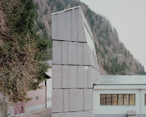 ES-arch designs spluga climbing gym as concrete monolith in northern italian mountains