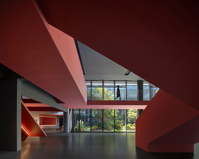 red cantilevered volumes outline one house design's shanghai techstorm exhibition hall