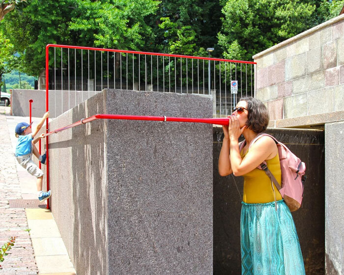 playful red tubes form moradavaga's interactive sound installation at italian fire station