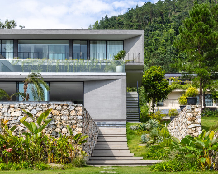 garden courtyards wind through stacked cubes of idee architects' vietnam hillside house