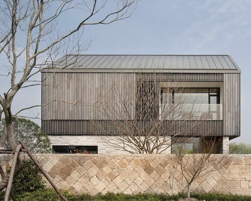 yakisugi wood and stone scraps wrap levels of urbanfabric design's cabin in china wetlands